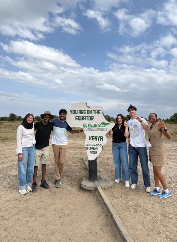 Team at the equator line marker